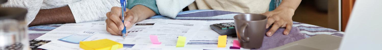 Photo of Black couple reviewing financial documents 