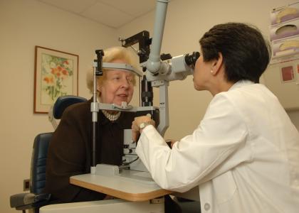 Elderly woman receiving an eye exam