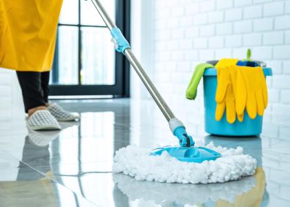 Photo of cleaner mopping a floor