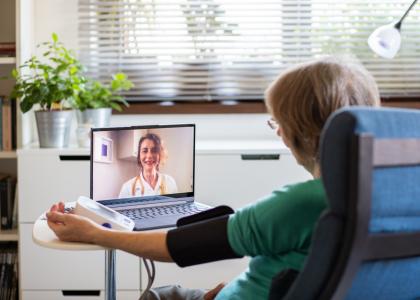 Photo of older woman receiving Telehealth appointment with physician 